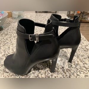 Michael Kors woman’s Lawson open toed boots.